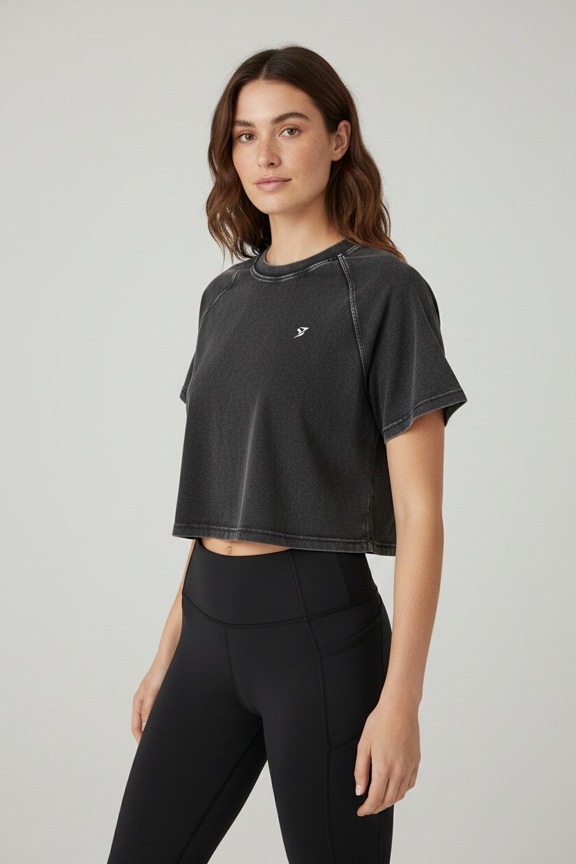 Stryvn women's black acid wash crop t-shirt with short sleeves and a relaxed fit.