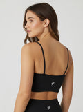 Stryvn black Core Strap sports bra with thin shoulder straps and a sculpted fit. Lightweight and designed for performance.