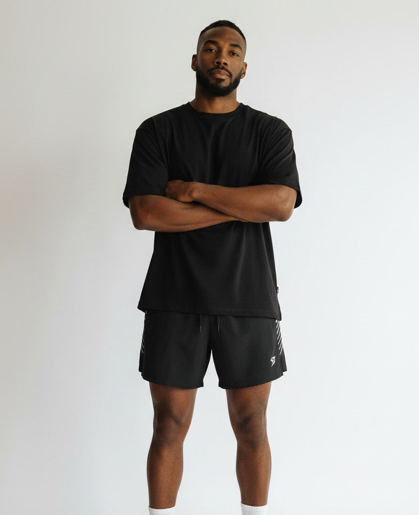 Stryvn black athletic fit performance shorts with white side stripe detail and logo.