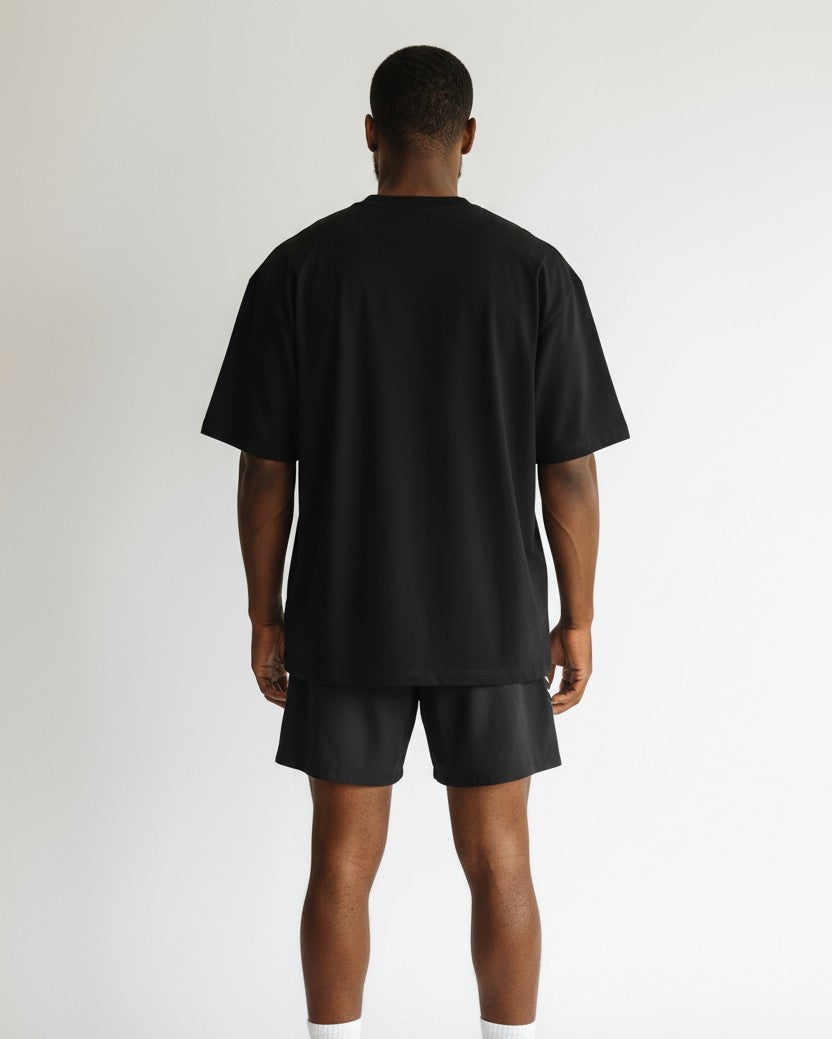 Stryvn black athletic fit performance shorts with white side stripes and elastic waistband.