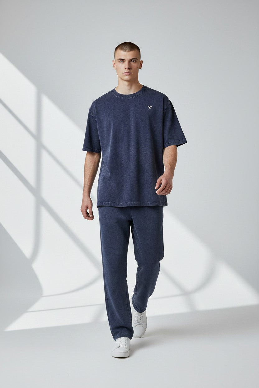 Stryvn navy blue oversized cotton t-shirt with a vintage wash and embroidered logo. Relaxed fit for everyday performance.