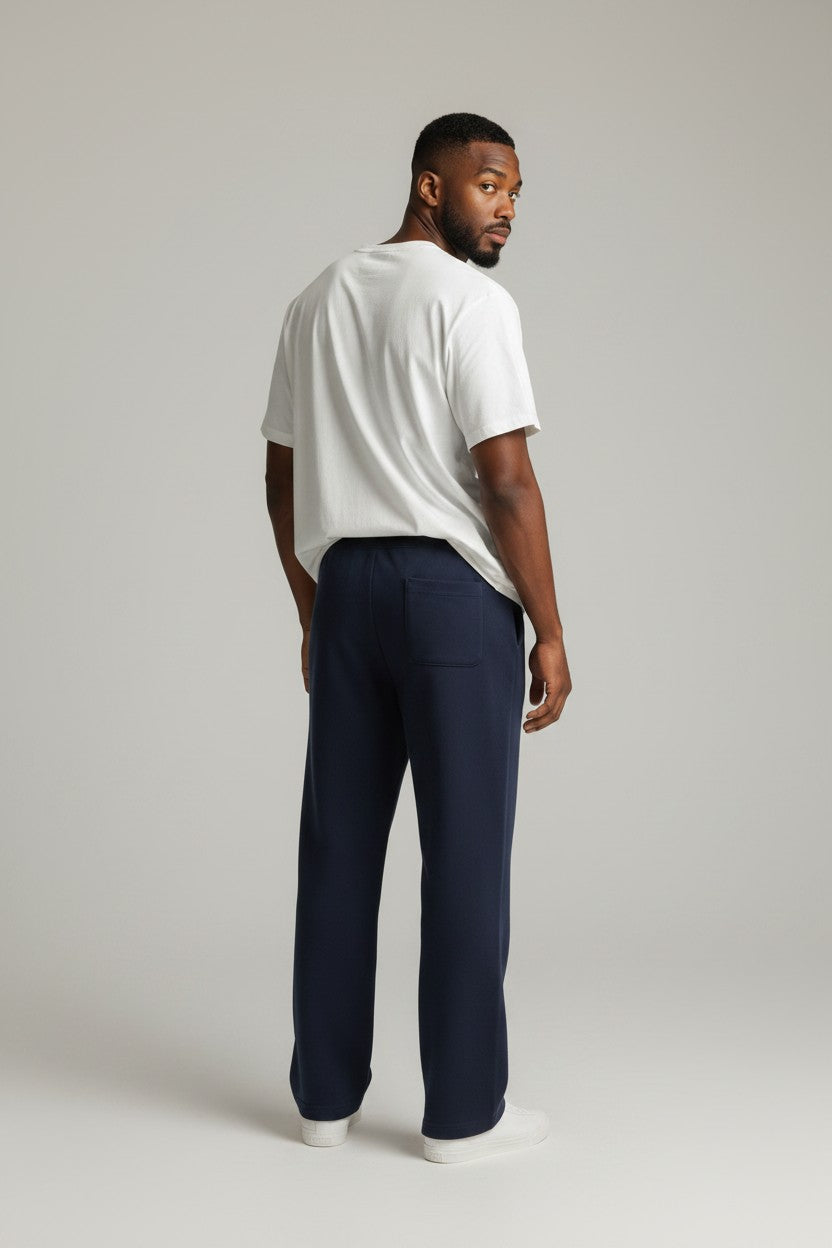 Stryvn navy blue straight-leg sweatpants with two back pockets and elastic waistband.