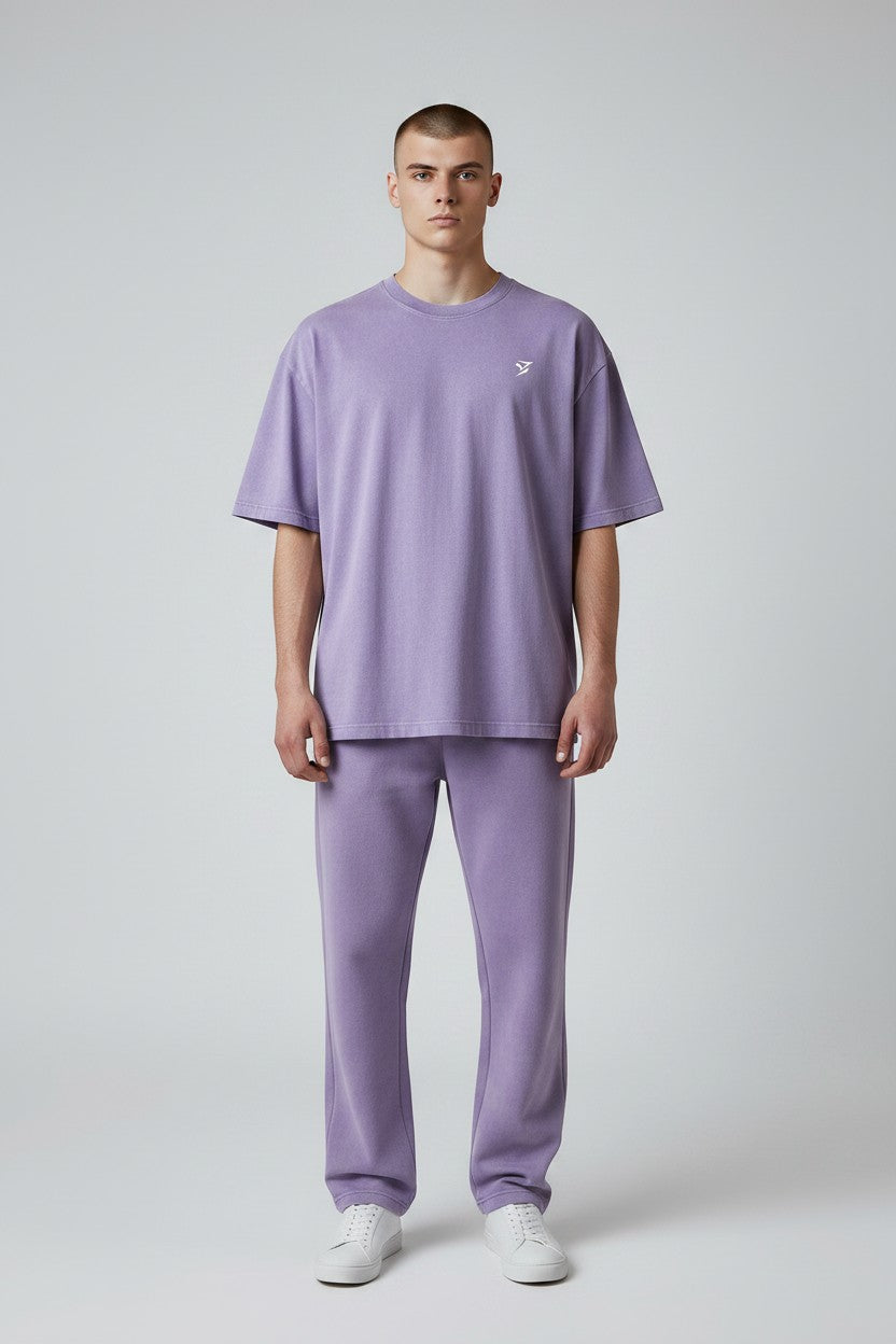 Stryvn Core Oversized Cotton T-Shirt in washed purple with a small white logo on the chest. Relaxed fit, ideal for everyday performance and comfort.