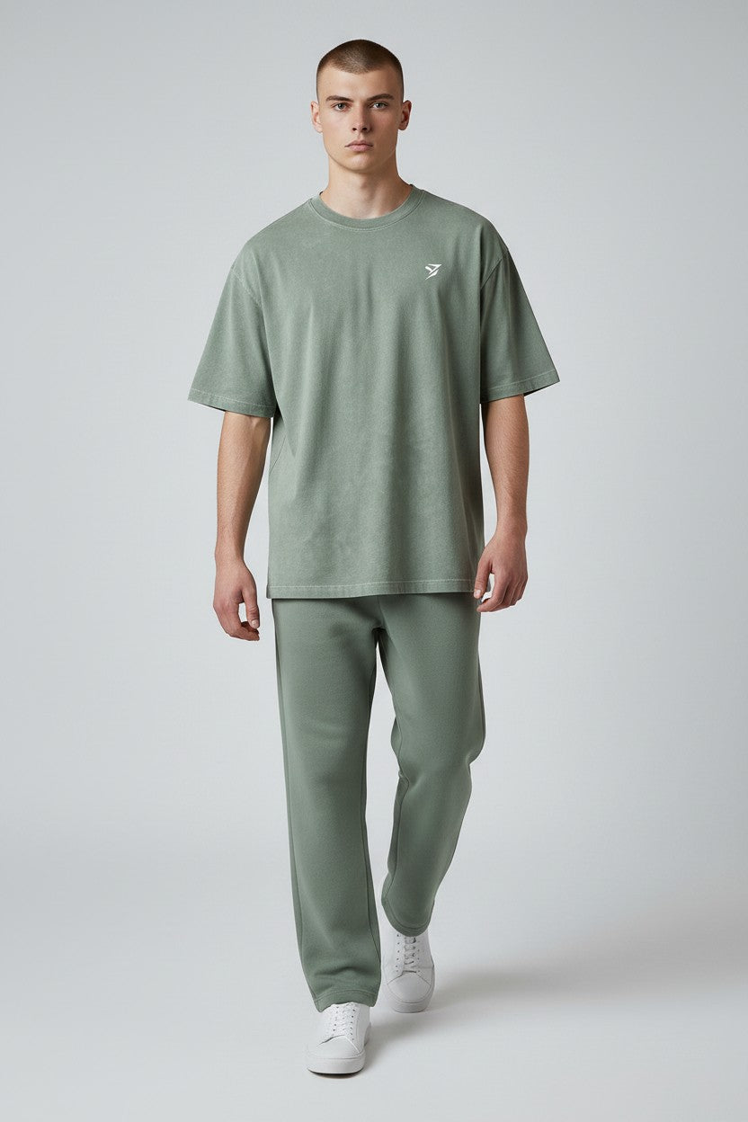 Stryvn oversized washed green cotton t-shirt with embroidered logo. Relaxed fit for everyday performance.