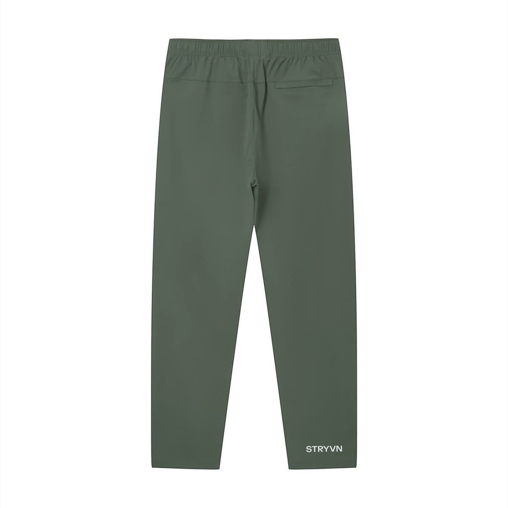 Stryvn olive green unisex performance track pants with athletic fit and lightweight feel.